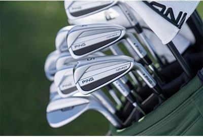 Ping i240 irons in a golf bag.