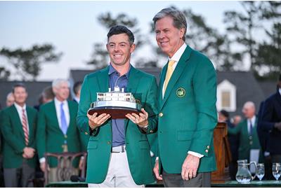 Rory McIlroy poses with Masters chairman Fred Ridley and the Masters trophy.